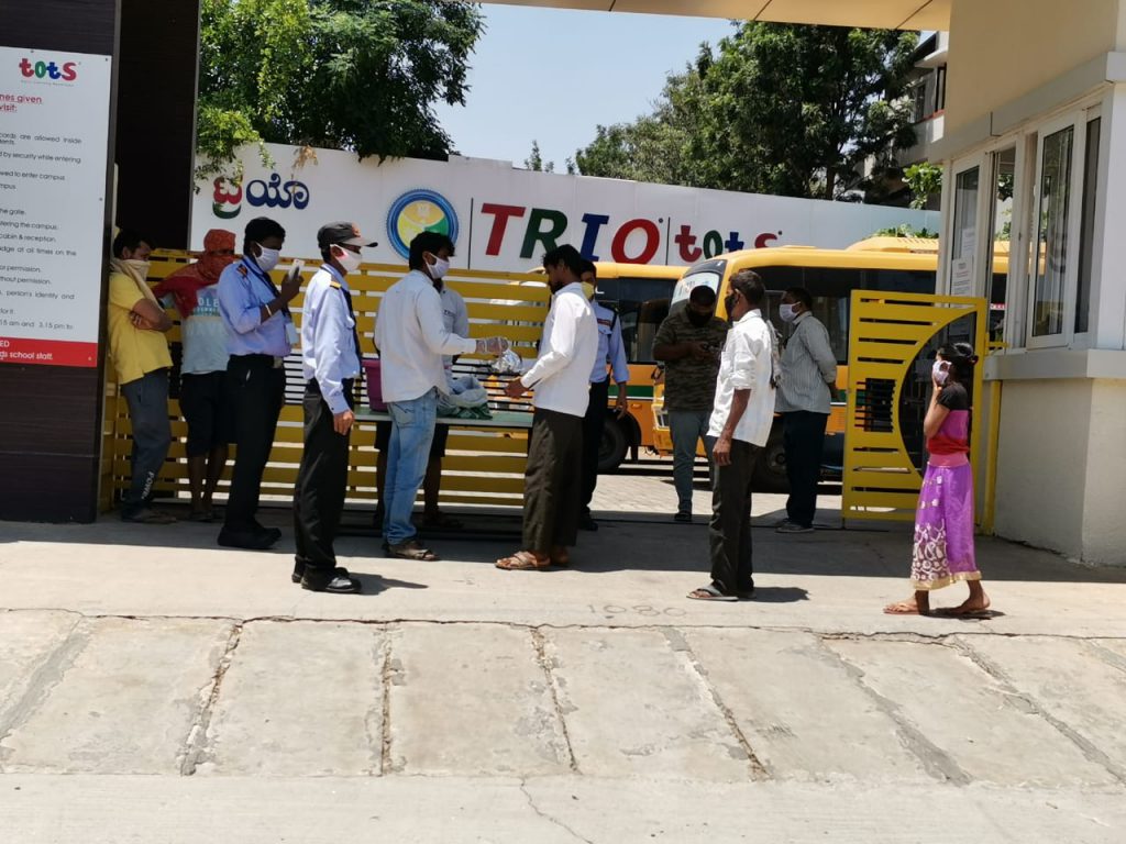 TRIO World Academy management distributes over 250 food packets, every day in North Bangalore